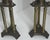 A striking pair of vintage brass hurricane candle holders featuring tall clear glass shades and sculptural architectural...