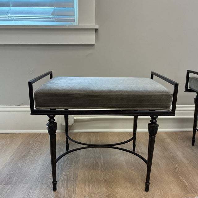 Pair of sculptural iron benches with dark gray velvet fabric. Great for end of a bed or additional seating. These are a...