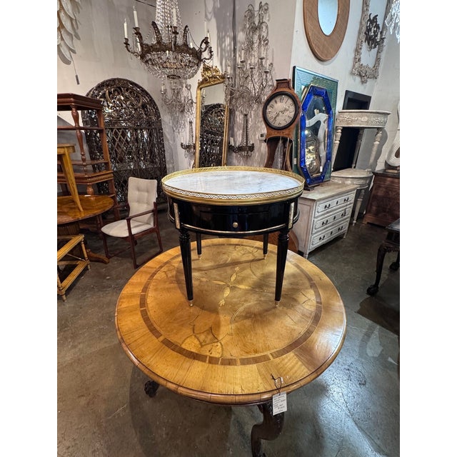The Jansen Manner Black Lacquer Side Table is a stylish and elegant piece of furniture. Its sleek black lacquer finish and...