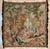 Handwoven wool tapestry depicting a classical pastoral garden scene with elegantly dressed figures gathered around a...
