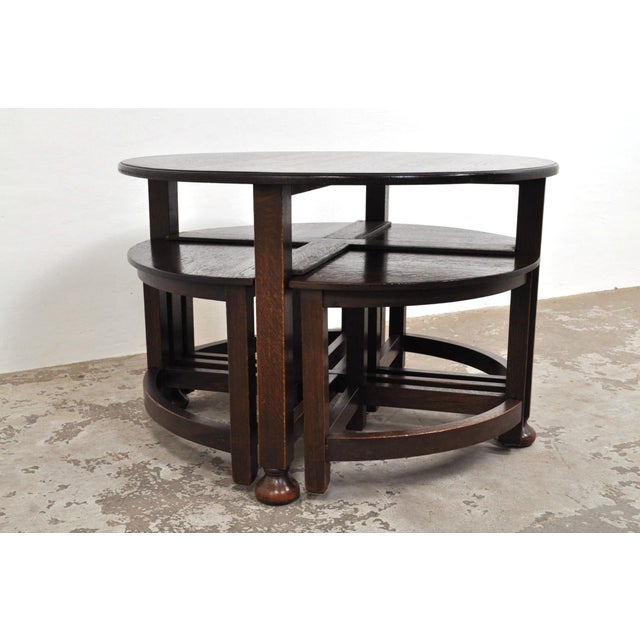 A truly unique coffee table, because the four separate tables underneath can also be used as smaller tables, or as one...