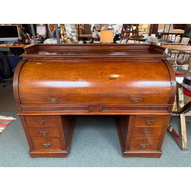 Design Plus Gallery presents an 1860’s Roll-Top English Victorian Secretary Desk. This is an impressive and bold antique...