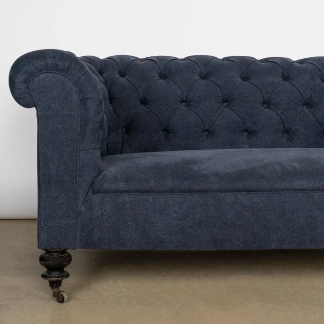 Elegantly tufted 19th-century french napoleon iii sofa, a true testament to the craftsmanship of its era.the addition of...