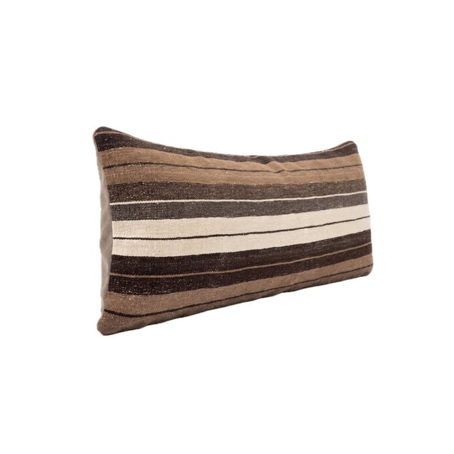 This beautiful 15'' x 43'' pillow cover was made from authentic Turkish Kilim pieces. Bright colors of wool adorn the...