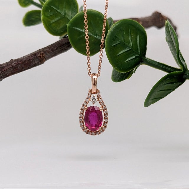 This beautiful pendant features a 1.19 carat oval ruby gemstone with natural earth mined diamonds, all set in solid 14K...