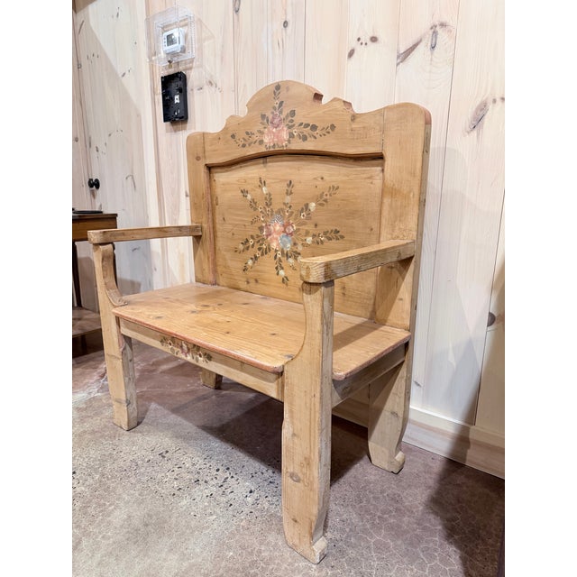 A delightful antique folk art armchair showcasing the warmth and charm of traditional country craftsmanship. Constructed...