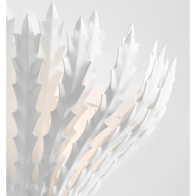 The Hampton series by AERIN creates a lit-from-within effect as light streams past sculpted metal leaves. Cutting-edge...