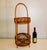 Small bottle holder/bamboo/wicker objects, 1960s/70s Round model with arched handle. Two shelves, the bottom one divided...