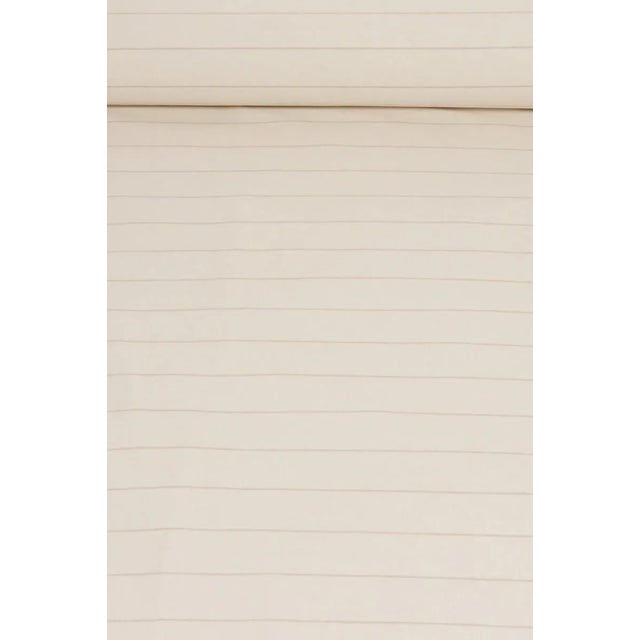 Cadiz is a woven double width fabric. Simple and classic, the coloured narrow stripe sits alongside an off-white base...