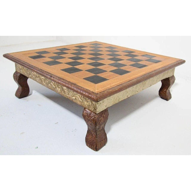 The board is nicely carved with Rajasthani designs at the rim, the sides and feet are covered with clad silver metal...