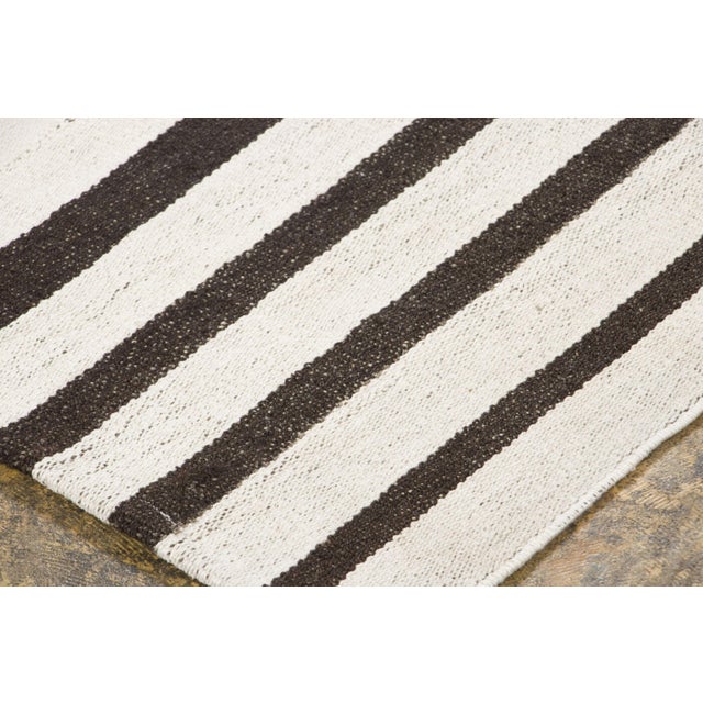 Handwoven in pure hemp and originating circa 1950-1959, this 5x6 vintage Turkish panelled kilim rug joins Rug & Kilim’s...
