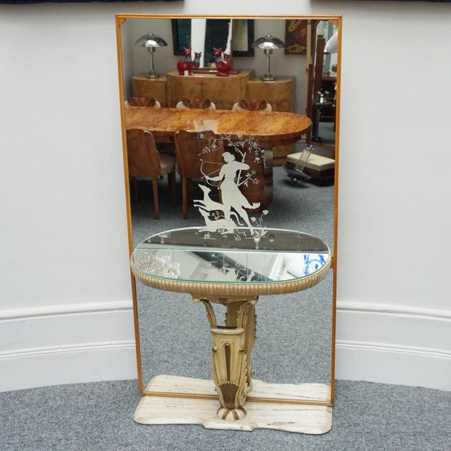 An Art Deco mirrored console by Fontana Arte Milano with original decorated glass depicting Diana the Huntress. Mirrored...