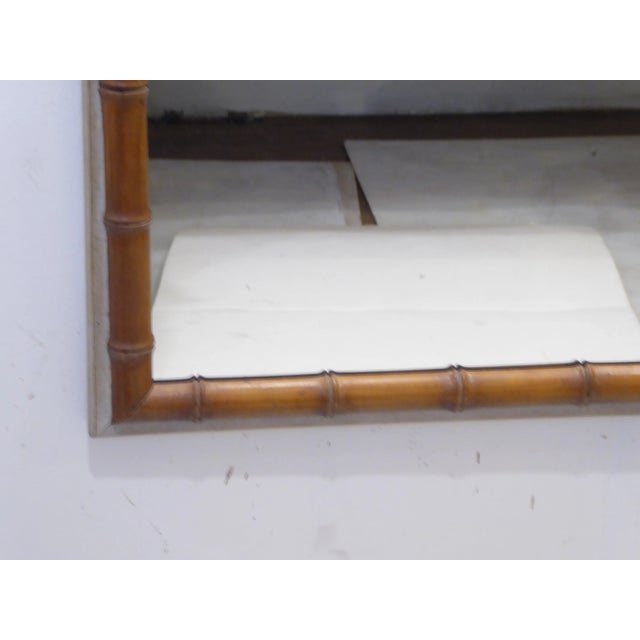 Early 20th Century French faux-bamboo mirror with painted edge, 50.75" x 28.75".