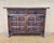 This striking Spanish rustic sideboard is crafted from solid wood and enriched with hand-carved geometric panels across...