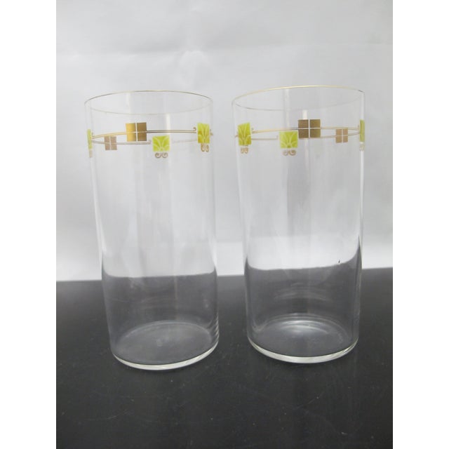 Very fine pair of crystal water tumbler glasses. Mid century modern, clear crystal with gilt and green enamel design....