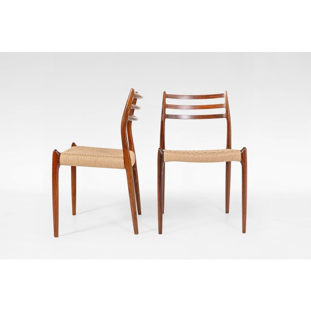 This set of four Model 78 dining chairs, designed by Niels Otto Møller in the 1950s and produced by J.L. Møller...