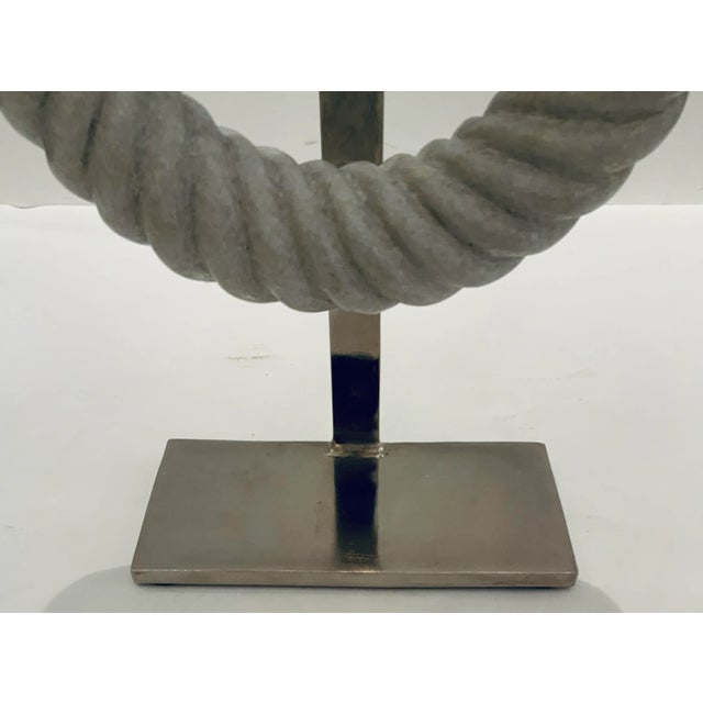 Elegant Small Modern Carved White Marble Ring Sculpture, polished nickel stand, showroom floor sample