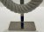 Elegant Small Modern Carved White Marble Ring Sculpture, polished nickel stand, showroom floor sample