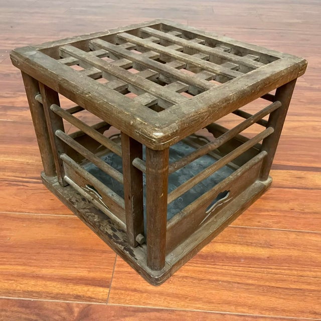 This vintage Japanese hibachi-style kotatsu base was traditionally used to hold hot coals beneath a low table for warmth....