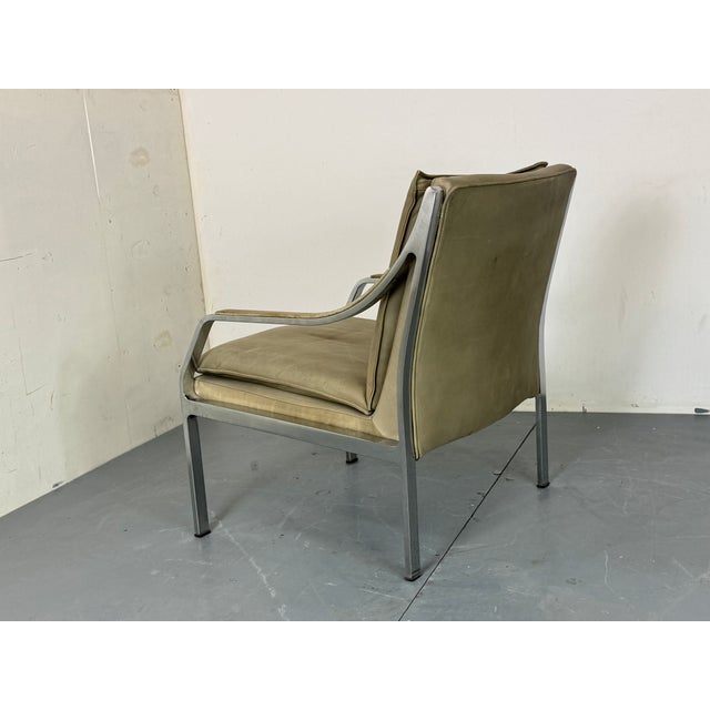 This easy chair was produced by Walter Knoll in Germany from a design by Kastholm and Fabricius It is upholstered in grey...