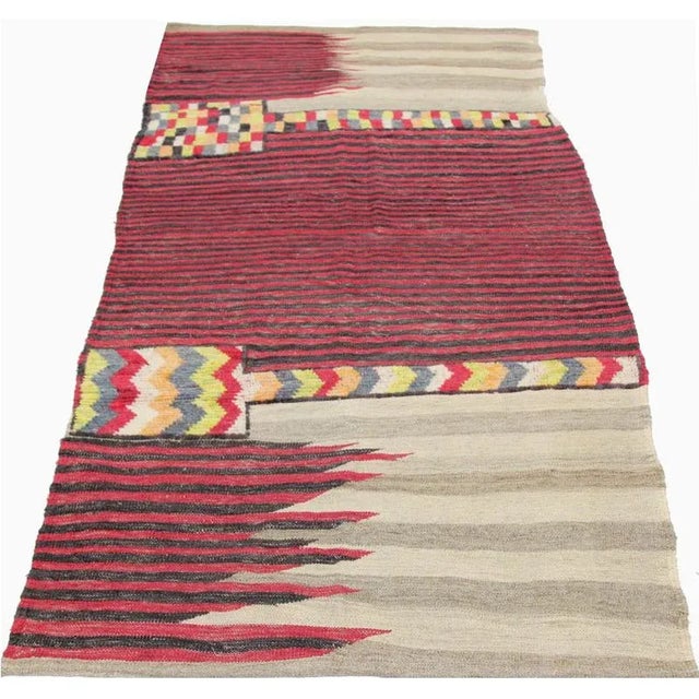 This bewitchingly beautiful example of a tribal Kilim area rug features a contemporary pop of electrifying bright colors...
