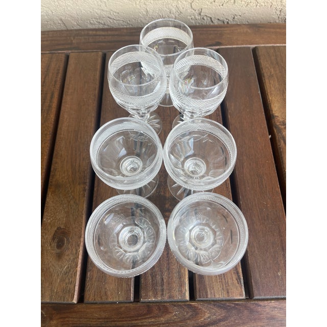 The glassware pictured is the Colleen (Short Stem)pattern by Waterford Crystal. These specific glasses are champagne...