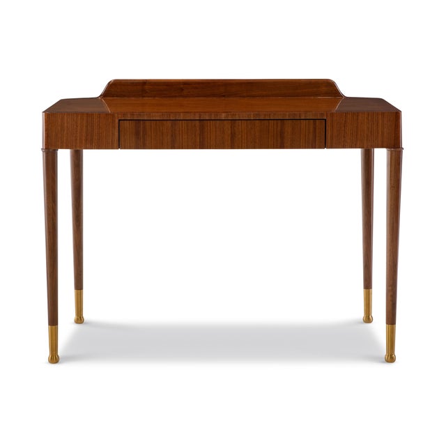 Elegant and understated, this writing desk pairs clean modern lines with classic craftsmanship. The rich walnut veneer...
