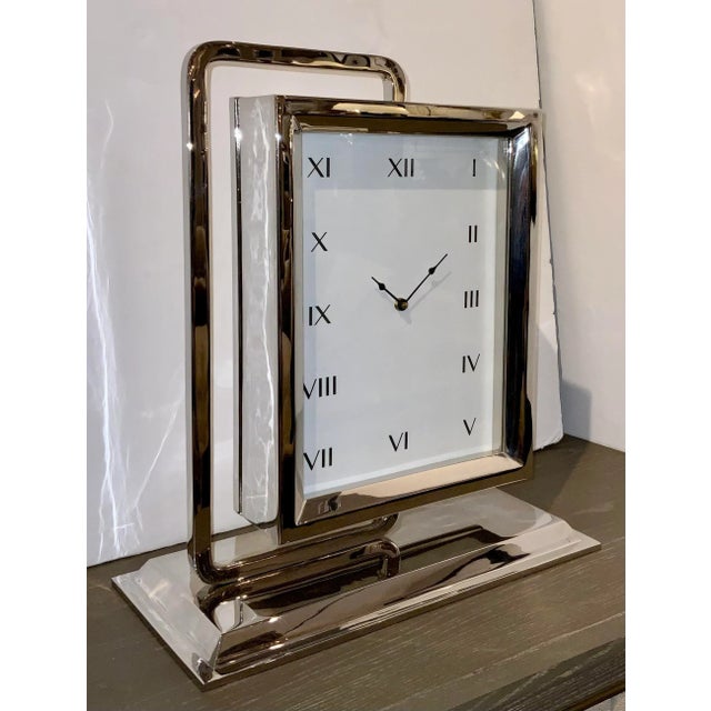 Original retail $1847, Stylish modern Global Views Time to Reflect Polished Nickel Clock, showroom floor sample