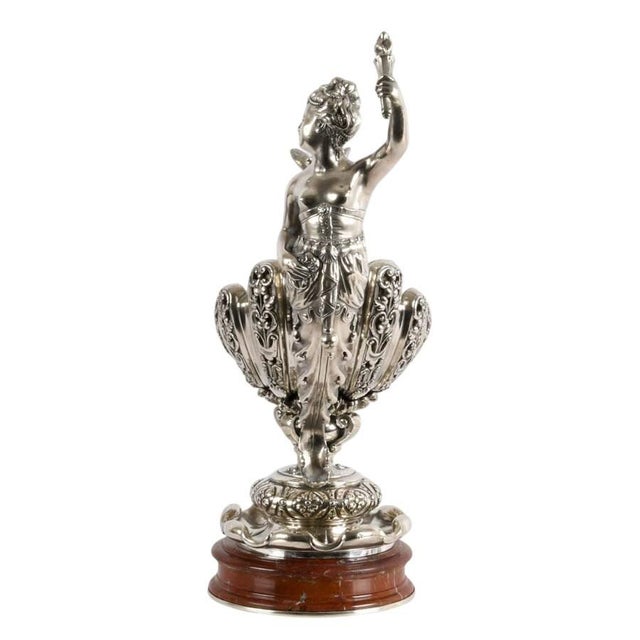 A magnificent example of late Victorian silverplate artistry, this richly sculptural centerpiece celebrates the grandeur...