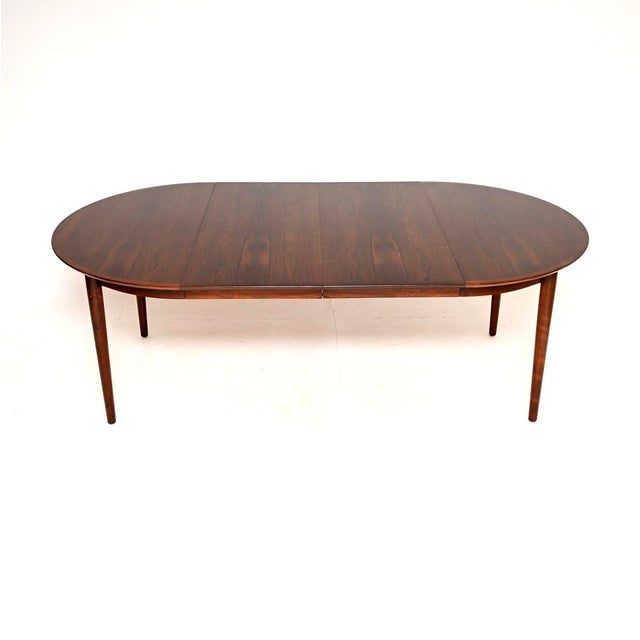 An absolutely stunning Danish vintage dining table by Arne Vodder. This was made in Denmark by Sibast, it dates from the...