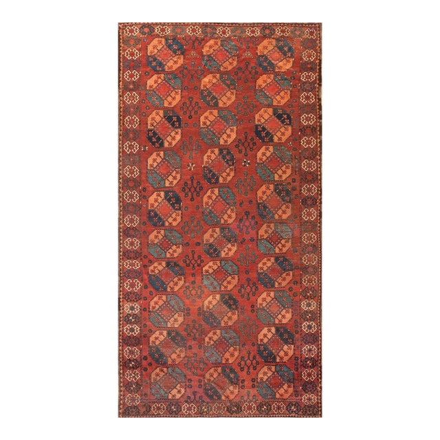 Impressive Red-Ruby Ground Color With Some Cherries Details in a Geometric Design Antique Central Asian Ersari Gallery Rug For Sale