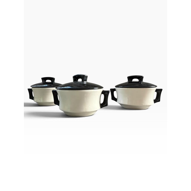 Striking vintage set of three Arnel’s ceramic covered dishes in a sophisticated black and cream palette. Each petite dish...