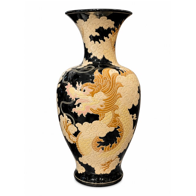 This striking pair of late 19th‑century English ceramic dragon vases brings dramatic scale and sculptural presence to any...
