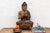 This commanding wooden statue depicts Sakyamuni, the Medicine Buddha, a revered figure in Mahayana Buddhism who embodies...