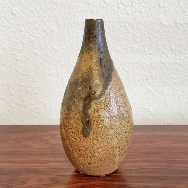 A stylish, pint-size, teardrop bud vase hand thrown by West German master art potter Luise Duncker in her Flensburg...