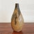 A stylish, pint-size, teardrop bud vase hand thrown by West German master art potter Luise Duncker in her Flensburg...