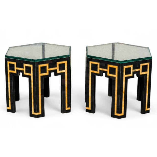 This Pair of postmodern low-profile tessellated stone side tables, circa 1980s, featuring hexagonal glass tops and...