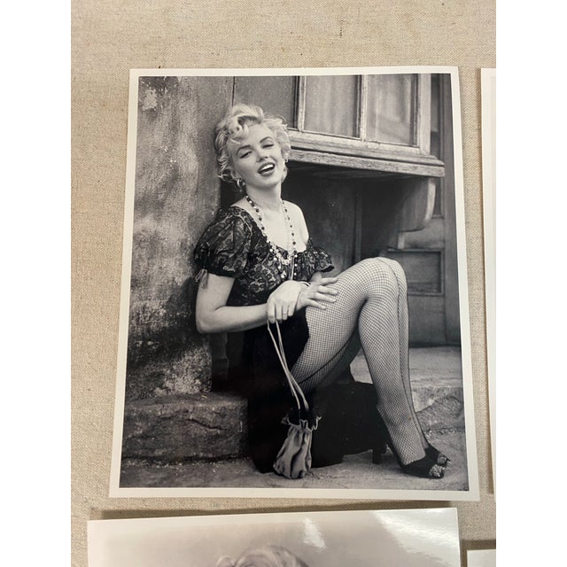 1 classic black-and-white portrait of Hollywood icon Marilyn Monroe. This image captures her signature 1950s look,...