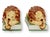 Mid 20th century Italian faience lions modeled in reclining form with expressive hand painted features and warm cream,...