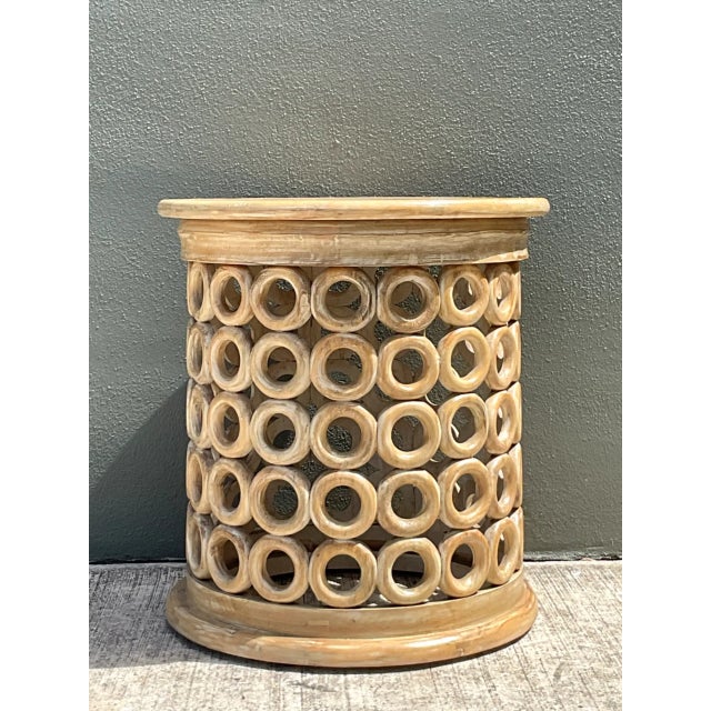 This vintage side table embodies the Mid-Century Modern design ethos through its striking openwork construction, crafted...