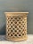 This vintage side table embodies the Mid-Century Modern design ethos through its striking openwork construction, crafted...