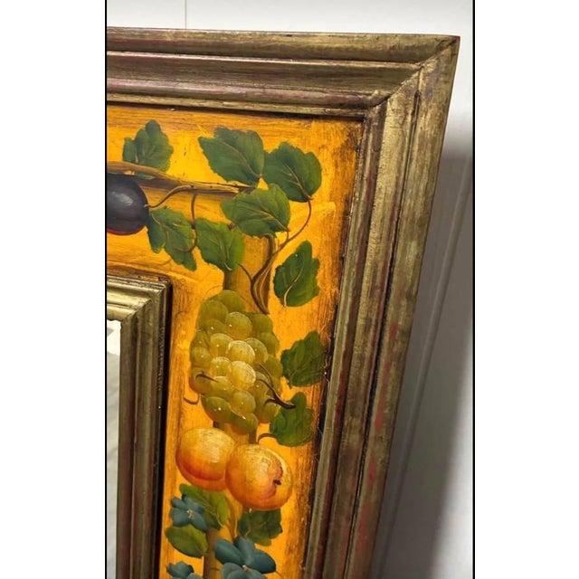 A richly painted fruit-and-vine border motif turns this (gorgeous) large vintage wall mirror into a decorative focal...