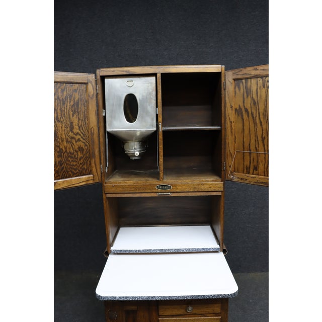 Rare late 19th-century Victorian salesman sample or miniature Hoosier-style kitchen cabinet by Sellers, crafted in quarter...