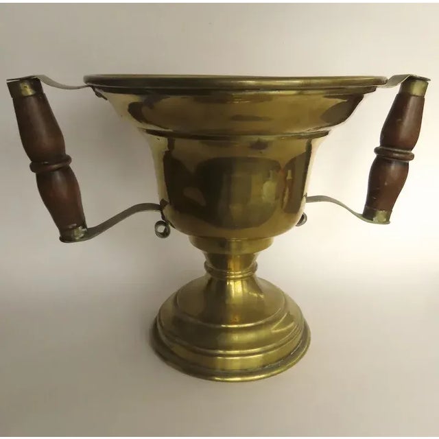 Nice brass two handled hot coal carrier or wine cooler. Measures : handle to handle 11 1/2" wide diameter across (without...