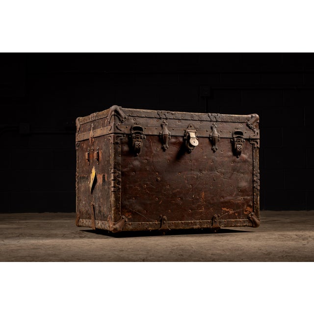 c. 1900s; Duluth Trunk Co. - Duluth, MN Turn of the century flat top trunk on casters.