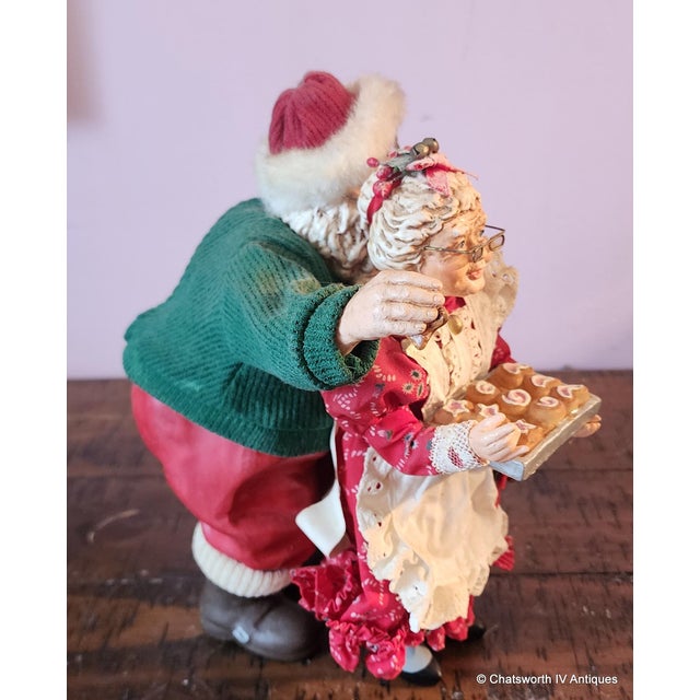 Great Holiday Christmas Statue Santa and Mrs. Claus ~ Santa Steals A Kiss & A Cookie, 1990s. Made from resins and molded...