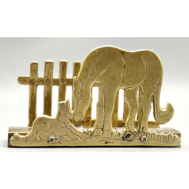 Charming English equestrian solid brass letter rack. Circa 1930's, it features a horse and dog's sweet nuzzles with a...