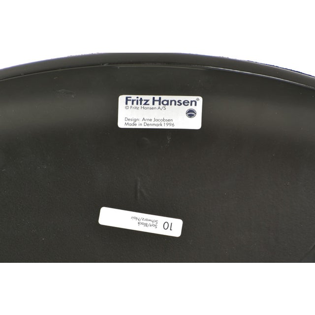 Model 3207 chairs in black kvadrat upholstery by arne jacobsen for fritz hansen, denmark, 1996, set of 4 the 3207 chair is...