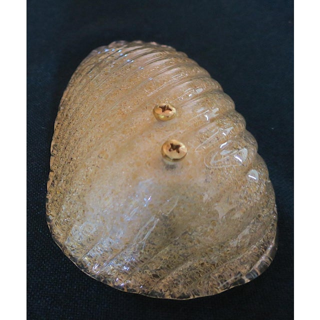 Mid-century Italian conch shaped wall light in gold flecked Murano glass, 1960s. Unusual feature: two large decorative...