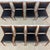 A beautiful set of 8 mid century modern oak frame dining chairs in a rich walnut stain and black vinyl seats....
